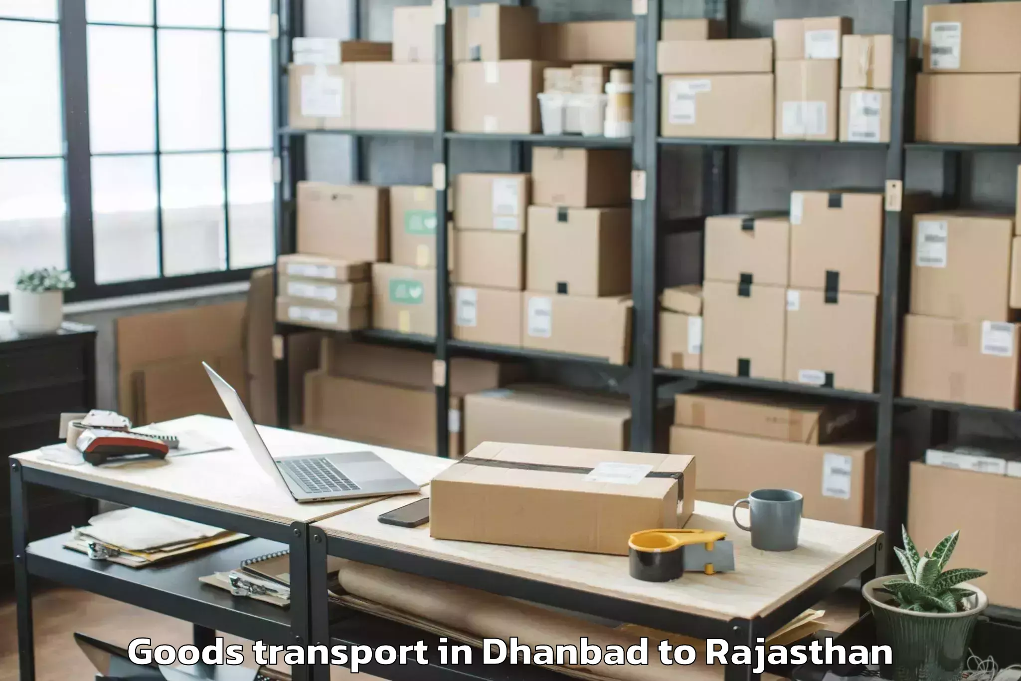 Professional Dhanbad to Raj Rishi Bharthari Matsya Uni Goods Transport